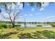Scenic lake view showing clear water and lush shoreline vegetation at 1396 Lucerne Loop Ne Rd, Winter Haven, FL 33881