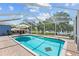 Inviting pool with screened enclosure and comfortable lounge seating for relaxation at 1396 Lucerne Loop Ne Rd, Winter Haven, FL 33881