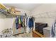 Walk-in closet with ample shelving, hanging space, and wood flooring for organized storage solutions at 1396 Lucerne Loop Ne Rd, Winter Haven, FL 33881