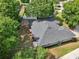 An aerial view of the home showing its roof, trees and landscaping at 6047 Cason Way, Lakeland, FL 33812