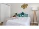 Bedroom featuring hardwood floors, a closet, and stylish decorations at 6047 Cason Way, Lakeland, FL 33812