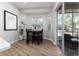 Bright dining area featuring a bay window, hardwood floors, and sliding glass door to the patio at 6047 Cason Way, Lakeland, FL 33812