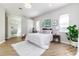 Stylish main bedroom featuring a plush rug, accent lighting, and serene decor at 6047 Cason Way, Lakeland, FL 33812