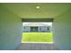 View of backyard and home's rear facade, offering a glimpse of outdoor living and curb appeal at 2123 Cartgate Lane, Winter Haven, FL 33884