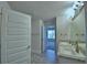 Well-lit bathroom with double sinks and a large mirror, offering a functional and stylish space at 2123 Cartgate Lane, Winter Haven, FL 33884
