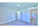 Spacious bedroom with neutral walls, carpet, and multiple doorways at 2123 Cartgate Lane, Winter Haven, FL 33884