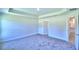 Spacious bedroom with carpet, white walls, and a tray ceiling at 2123 Cartgate Lane, Winter Haven, FL 33884
