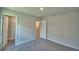 Spacious bedroom with carpet and open doorway to closet, offering plenty of storage at 2123 Cartgate Lane, Winter Haven, FL 33884