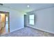 Neutral bedroom with carpet, trim, and a window at 2123 Cartgate Lane, Winter Haven, FL 33884