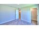 Neutral bedroom with closet and bathroom access at 2123 Cartgate Lane, Winter Haven, FL 33884