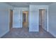 Spacious bedroom with access to multiple rooms, offering easy access to other parts of the home at 2123 Cartgate Lane, Winter Haven, FL 33884