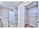 A hallway featuring doors and walk-in closet space, offering plenty of storage at 2123 Cartgate Lane, Winter Haven, FL 33884