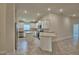 Modern kitchen with stainless steel appliances, white cabinets, and a kitchen island at 2123 Cartgate Lane, Winter Haven, FL 33884