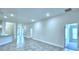 Large open living room with tiled floors at 2123 Cartgate Lane, Winter Haven, FL 33884