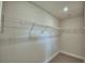 Walk-in closet with wire shelving and carpet at 2123 Cartgate Lane, Winter Haven, FL 33884
