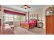 Spacious bedroom with a large bed, window seating and plenty of light at 318 Crescent Ridge Rd, Auburndale, FL 33823