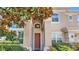 Two-story home's entrance with a large front door at 318 Crescent Ridge Rd, Auburndale, FL 33823