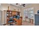 Home office with built-in shelving and a large workspace at 318 Crescent Ridge Rd, Auburndale, FL 33823