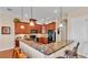 Spacious kitchen featuring granite countertops and dark wood cabinets at 318 Crescent Ridge Rd, Auburndale, FL 33823