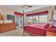 Spacious main bedroom with large windows and private access to a balcony at 318 Crescent Ridge Rd, Auburndale, FL 33823