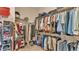 Large walk-in closet with ample shelving and hanging space at 318 Crescent Ridge Rd, Auburndale, FL 33823