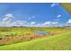 View of the backyard with preserve and pond at 4081 Tullamore Ln, Auburndale, FL 33823