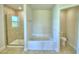 Bathroom with soaking tub and walk-in shower at 4081 Tullamore Ln, Auburndale, FL 33823