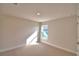 Light-filled bedroom with neutral walls and carpet flooring at 4081 Tullamore Ln, Auburndale, FL 33823