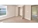 Bedroom with large window, closet, and view of backyard at 4081 Tullamore Ln, Auburndale, FL 33823