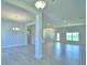 Spacious dining room with tile floors and chandelier at 4081 Tullamore Ln, Auburndale, FL 33823