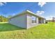 Exterior view of the home with covered patio at 4081 Tullamore Ln, Auburndale, FL 33823