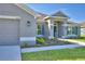 House exterior showcasing the front entrance and walkway at 4081 Tullamore Ln, Auburndale, FL 33823