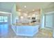 L-shaped kitchen island with granite countertops and white cabinets at 4081 Tullamore Ln, Auburndale, FL 33823