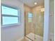 Large shower with glass enclosure and tile surround at 4081 Tullamore Ln, Auburndale, FL 33823