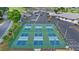 Overhead view of outdoor pickleball courts nestled in a community near ample parking at 5660 Sandpipers Dr, Lakeland, FL 33809