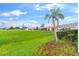 The pristine lawn borders a golf course, offering tranquil outdoor views and space for relaxation at 5660 Sandpipers Dr, Lakeland, FL 33809