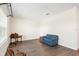 Cozy living room showcases laminate floors, large windows, and a blue sofa at 192 Viola Dr, Auburndale, FL 33823