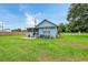 Large grassy backyard with home's rear elevation visible at 954 Reynolds Rd, Lakeland, FL 33801