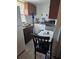 Well-lit kitchen with a dining table and essential appliances for convenient cooking at 2031 Poe St, Lakeland, FL 33801