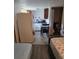 Open living space integrating a kitchen, dining area, and bedroom for compact living at 2031 Poe St, Lakeland, FL 33801