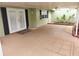 Spacious covered patio with french doors and neutral colored flooring at 2200 Starboard, Winter Haven, FL 33881