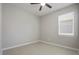 Well-lit bedroom with tile floors and a ceiling fan at 1912 Castleton Dr, Saint Cloud, FL 34771