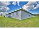 The backyard shows the home's neutral exterior at 4039 Tullamore Ln, Auburndale, FL 33823