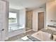 Well-lit bathroom showcases a soaking tub with a view, tiled shower, and granite countertops at 4039 Tullamore Ln, Auburndale, FL 33823