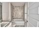 Bathroom features a shower and tub with tiled walls at 4039 Tullamore Ln, Auburndale, FL 33823