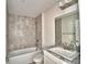 Bathroom featuring shower, tub, tiled walls, vanity, and granite countertop at 4039 Tullamore Ln, Auburndale, FL 33823