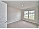 Bedroom with carpet and view out the window at 4039 Tullamore Ln, Auburndale, FL 33823