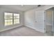 This bedroom features a carpet, window, and closet at 4039 Tullamore Ln, Auburndale, FL 33823