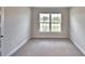 Bedroom with carpet and a view out the window at 4039 Tullamore Ln, Auburndale, FL 33823