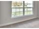Bedroom with large window and carpet at 4039 Tullamore Ln, Auburndale, FL 33823